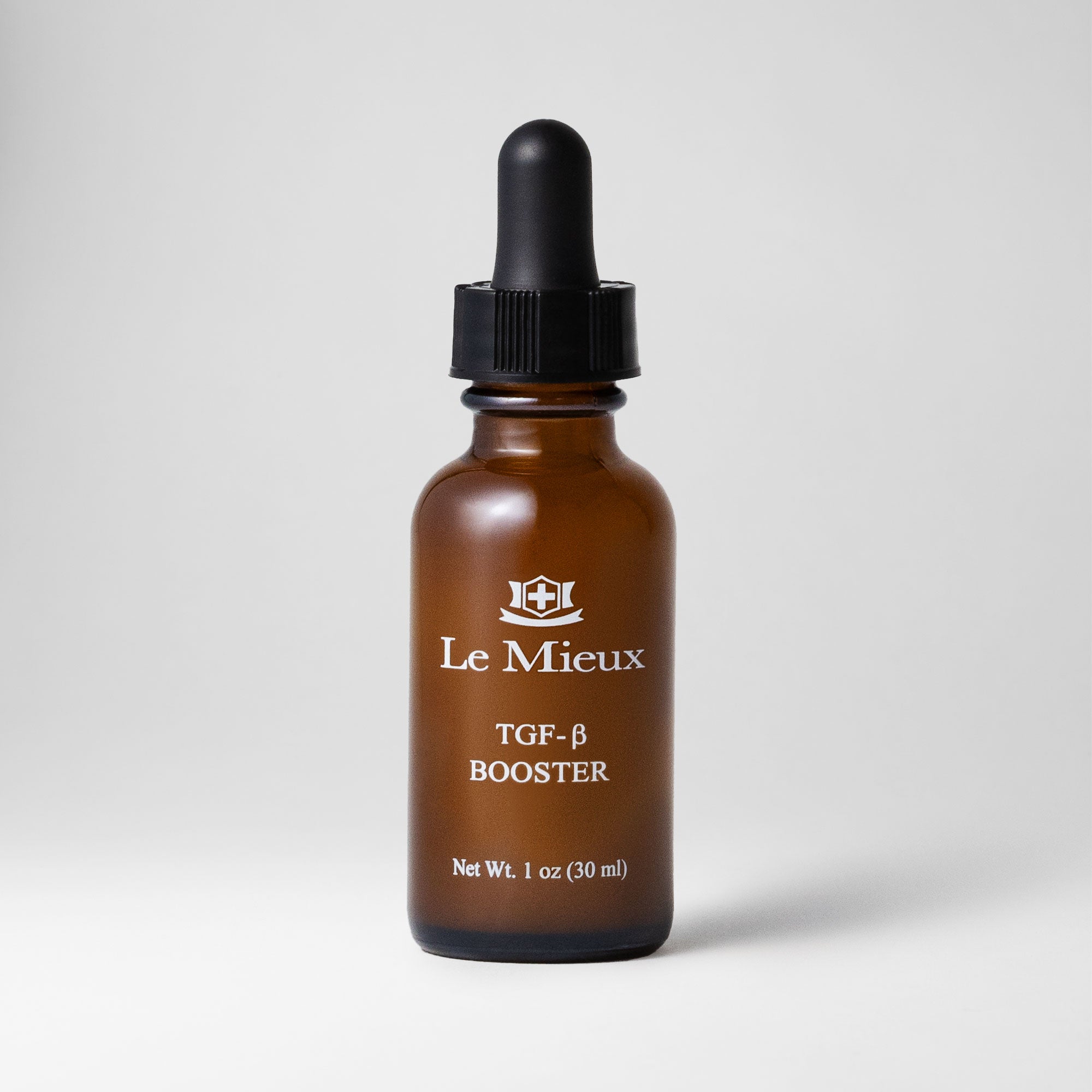 TGF-β Booster 1 oz amber bottle with black dropper lid isolated on a light grey background 