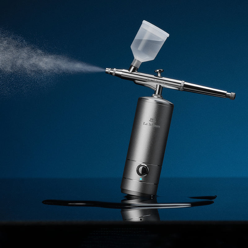 Ionized Oxygen Infuser machine spraying mist in front of a dark blue background